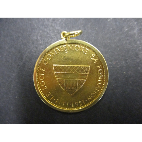 132 - A 1951 Swiss Le Locle Foundation 18ct gold token/medallion, in an 18ct gold mount, approx. total wei... 