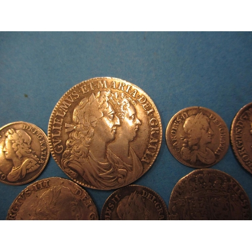 139 - A quantity of 17th century and later silver coins to include a William & Mary half crown with froste... 