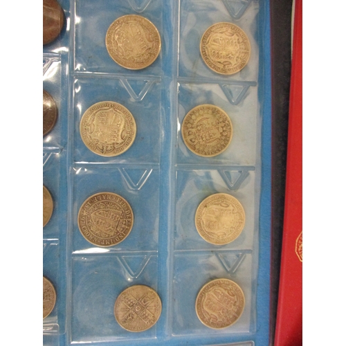 140 - An album of Victorian and later pre-decimal silver and other coins, to include half crowns and flori... 