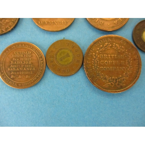 144 - A quantity of 19th century trade tokens to include a British Copper Company 1 penny