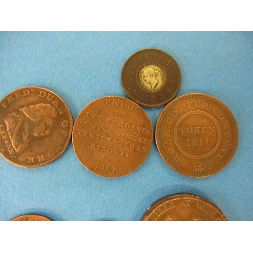 144 - A quantity of 19th century trade tokens to include a British Copper Company 1 penny