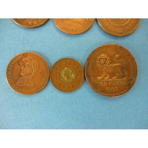 144 - A quantity of 19th century trade tokens to include a British Copper Company 1 penny