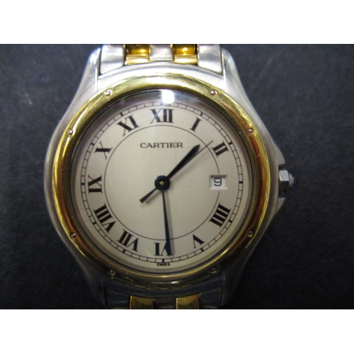 150 - A vintage Cartier quartz watch with ancillary date dial, in good working order