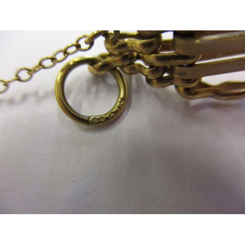 155 - A 9ct yellow gold bracelet with working heart clasp and safety chain, approx. weight 20g