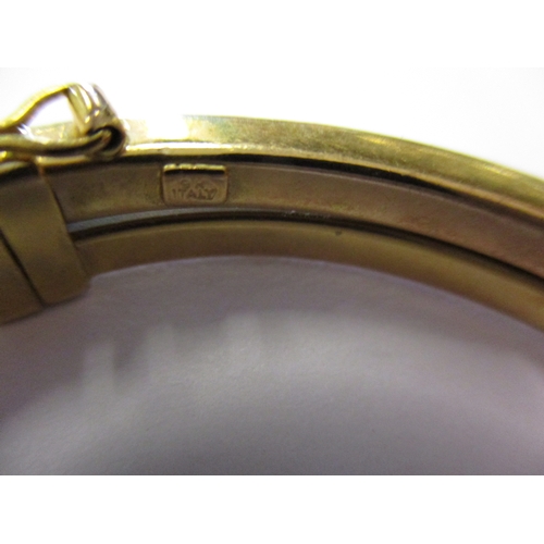 158 - A 9ct gold wrist bangle, approx. weight 9.3g