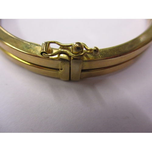 158 - A 9ct gold wrist bangle, approx. weight 9.3g