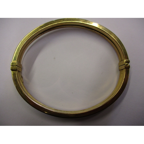 158 - A 9ct gold wrist bangle, approx. weight 9.3g