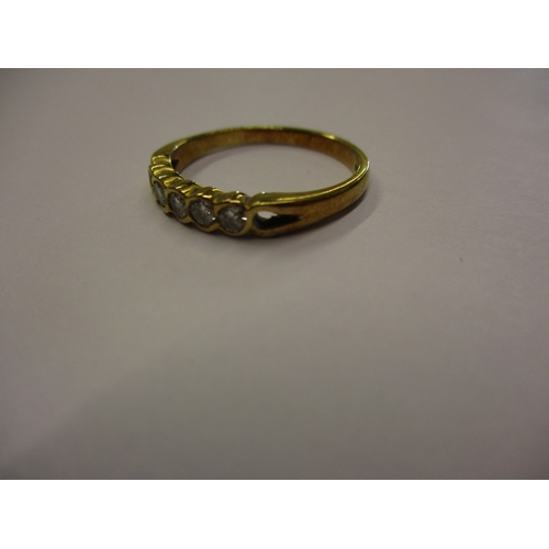 159 - An 18ct yellow gold eternity ring set with 5 diamonds, approx. ring size Q