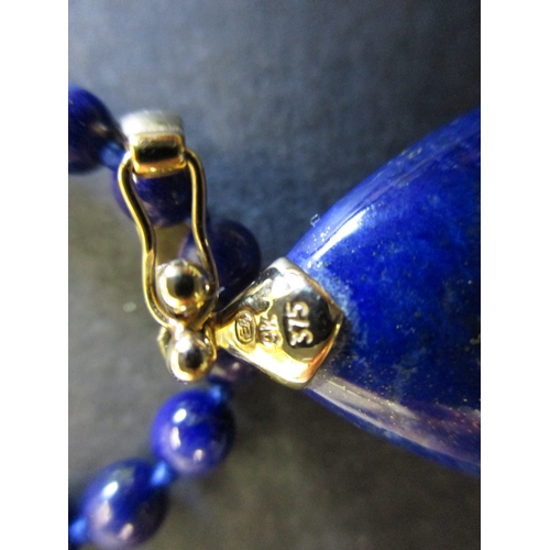 164 - A Lapis lazuli bead necklace with gold mounts and a 9ct gold necklace with a rose quartz pendant