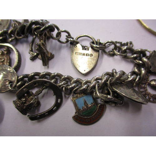 167 - A quantity of vintage silver jewellery to include charm bracelets, approximate weight 140g