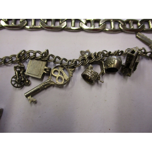 167 - A quantity of vintage silver jewellery to include charm bracelets, approximate weight 140g