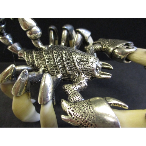 168 - A white metal and animal tooth scorpion sculpture