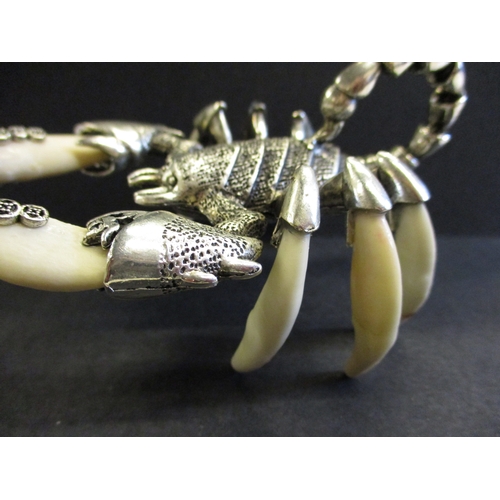 168 - A white metal and animal tooth scorpion sculpture