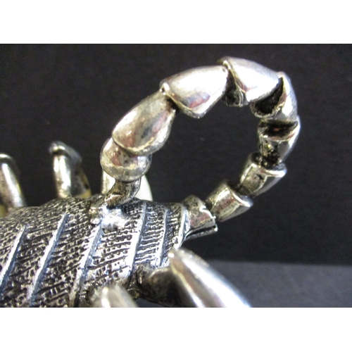 168 - A white metal and animal tooth scorpion sculpture