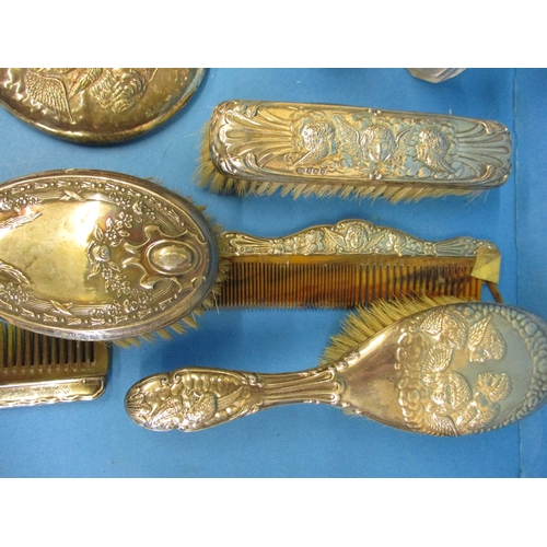 173 - A very large quantity of silver items, to include dressing table sets and bud vases