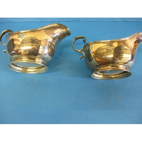 177 - A pair of early 20th century sterling silver sauce boats, approx. weight 255g