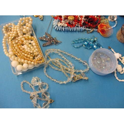 185 - A large quantity of vintage costume jewellery, to include some silver items