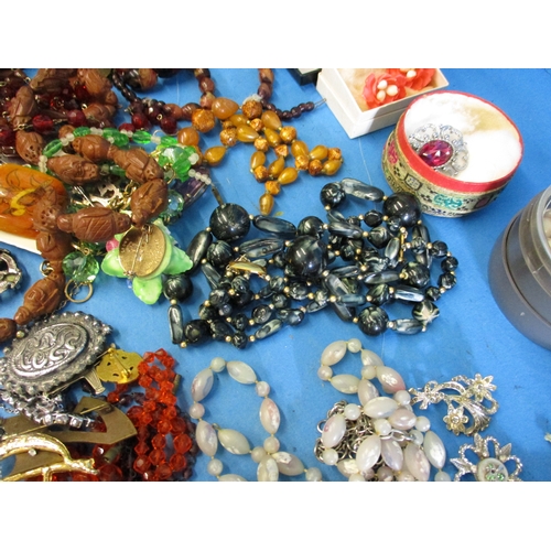 185 - A large quantity of vintage costume jewellery, to include some silver items