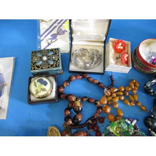 185 - A large quantity of vintage costume jewellery, to include some silver items