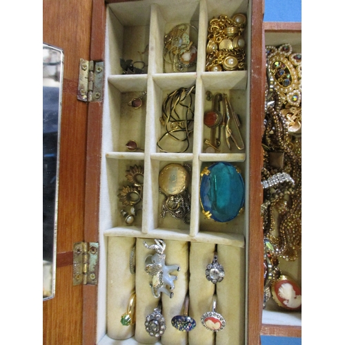 193 - A jewellery box with contents of costume jewellery to include a gold mounted necklace pendant