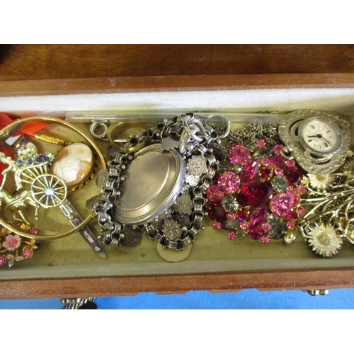 193 - A jewellery box with contents of costume jewellery to include a gold mounted necklace pendant