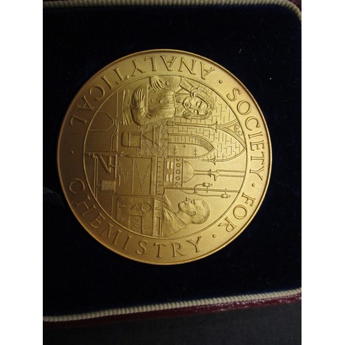 102 - A 9ct gold medal of the society for analytical chemistry, approx. weight 64.7g approx. diameter 51mm... 