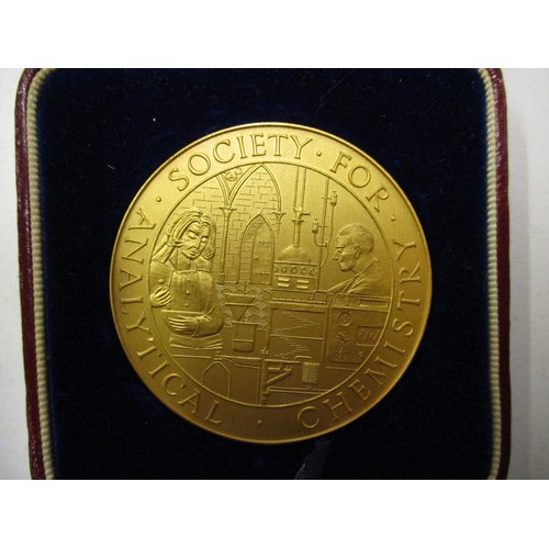 102 - A 9ct gold medal of the society for analytical chemistry, approx. weight 64.7g approx. diameter 51mm... 