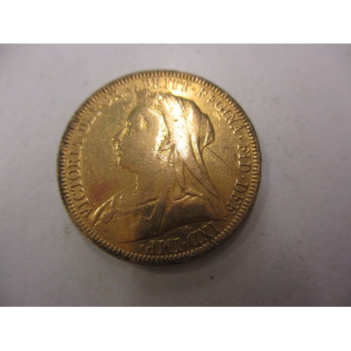 103 - An Victorian gold full sovereign dated 1893, with a loose 9ct gold mount,