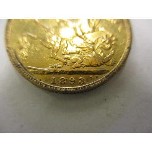 103 - An Victorian gold full sovereign dated 1893, with a loose 9ct gold mount,