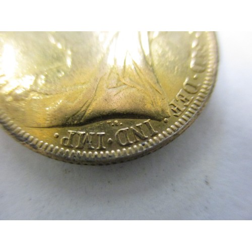 103 - An Victorian gold full sovereign dated 1893, with a loose 9ct gold mount,