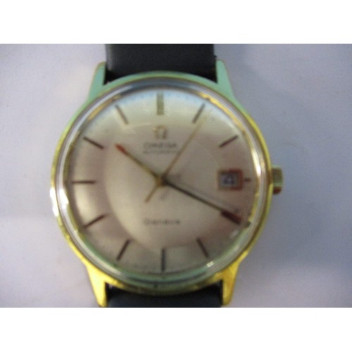 99 - A vintage Omega Automatic wrist watch with leather strap and yellow metal case. Dial diameter approx... 