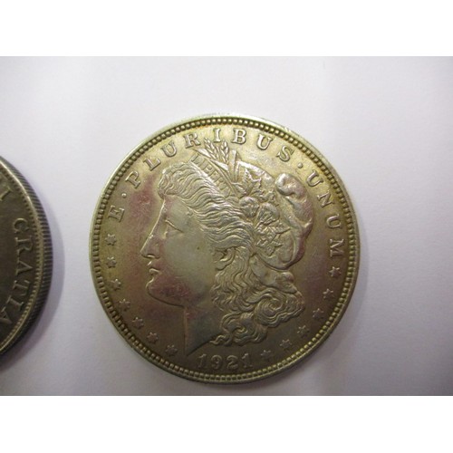 113 - A 1921 American silver Dollar and an 1887 Queen Victoria crown, approx. weight of dollar 26.7g appro... 