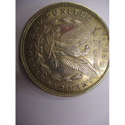 113 - A 1921 American silver Dollar and an 1887 Queen Victoria crown, approx. weight of dollar 26.7g appro... 