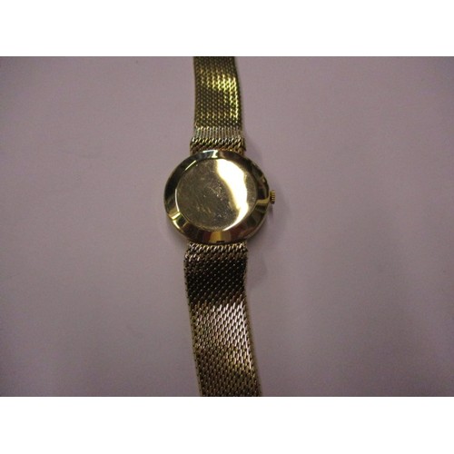 91 - A gold cased Record Automatic wristwatch, having a 9ct gold mesh strap and date dial. Dial diameter ... 