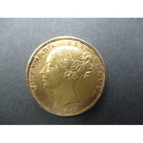 109 - A Victorian young head shield back sovereign dated 1863, in pre-owned condition with general age-rel... 