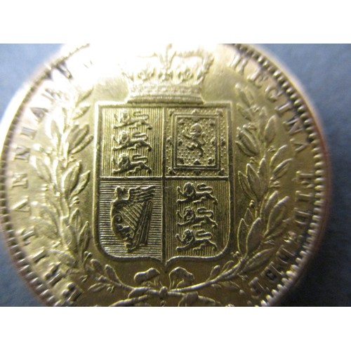 109 - A Victorian young head shield back sovereign dated 1863, in pre-owned condition with general age-rel... 