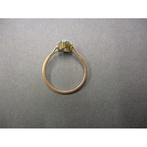 25 - An antique 9ct gold ring set with a pale blue stone, approx. weight 1.5g approx. ring size P, in pre... 