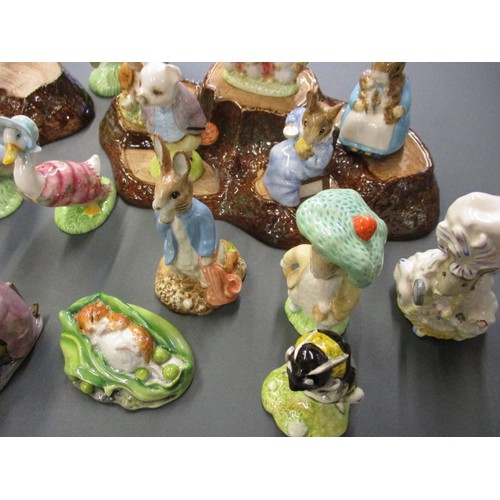 216 - A collection of vintage Beatrix Potter figures, all in un-damaged condition, also include 2 Beswick ... 