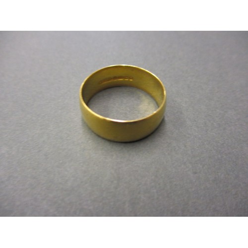 A 22ct yellow gold wedding band, approx. weight 6.8g approx. ring size S approx. width 7.3mm, in good condition with general use related marks