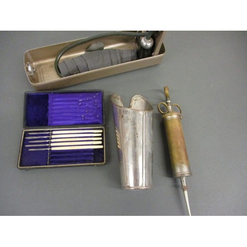 209 - Three vintage medical items, to include a part set of scalpels and a blood pressure gauge, in vintag... 