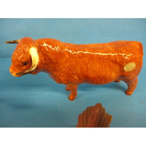 215 - A Border Fine Arts highland cow and other ceramic animal figures including one by Doulton, with no o... 