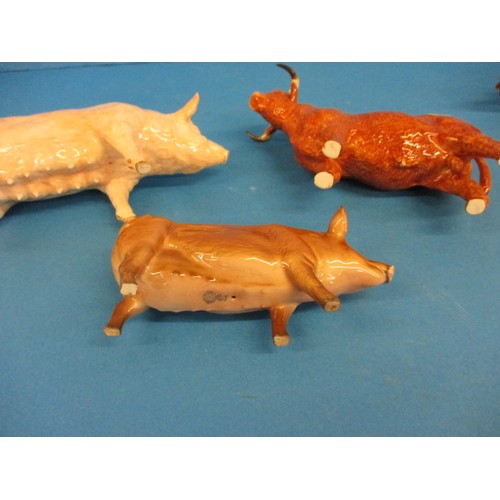 215 - A Border Fine Arts highland cow and other ceramic animal figures including one by Doulton, with no o... 