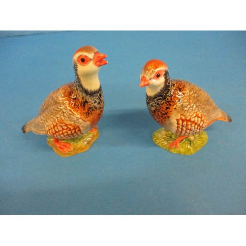 212 - A pair of Beswick red leg partridges, one having a very small chip, less then 1mm nip to the lower b... 