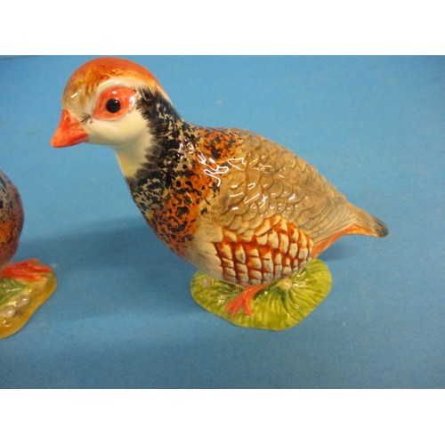 212 - A pair of Beswick red leg partridges, one having a very small chip, less then 1mm nip to the lower b... 