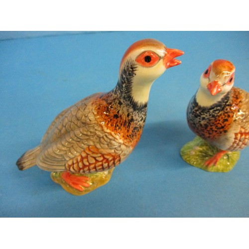 212 - A pair of Beswick red leg partridges, one having a very small chip, less then 1mm nip to the lower b... 