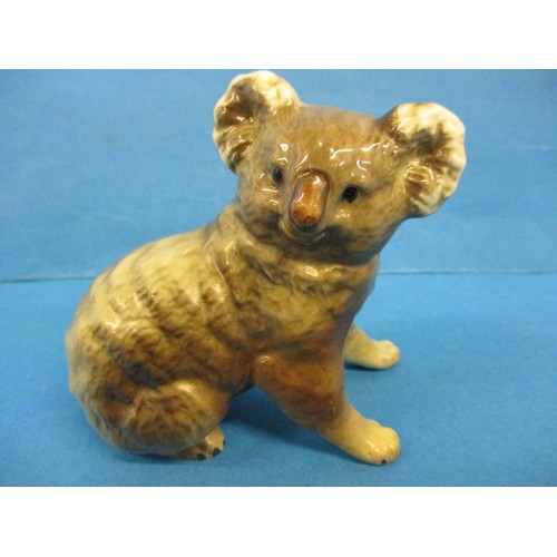 211 - A vintage Beswick camel and koala bear, both in good condition with no observed damage or restoratio... 