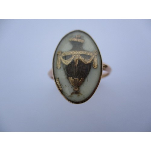 294 - A Georgian gold mourning ring with hair panel in the shape of an urn, dedication reads Rich Rolfe ob... 