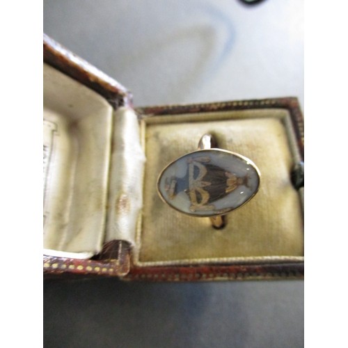 294 - A Georgian gold mourning ring with hair panel in the shape of an urn, dedication reads Rich Rolfe ob... 