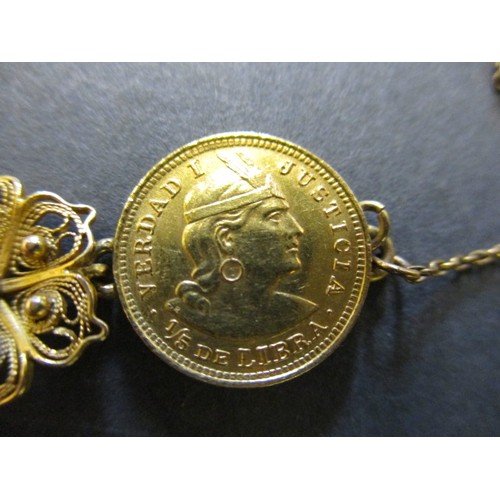 300 - A gold bracelet with filigree panels linking six Peruvian 1/5 Libra gold coins, approx. total weight... 