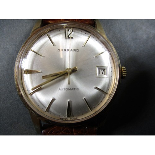 85 - A vintage 9ct gold cased gents automatic wristwatch from Garrards of London, in working order with o... 